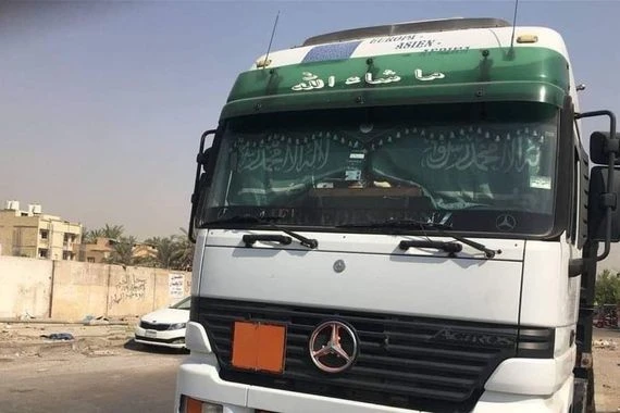 ضبط "تريلة" بداخلها أعلام سعودية وصور صدام حسين شرقي بغداد